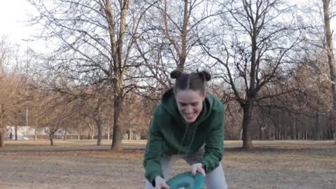 A Woman Playing with Her Dog