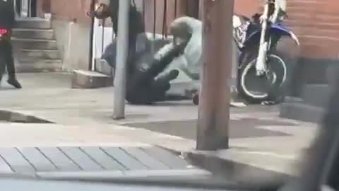 Biker takes down motorbike thieves attempting to steal his bike.