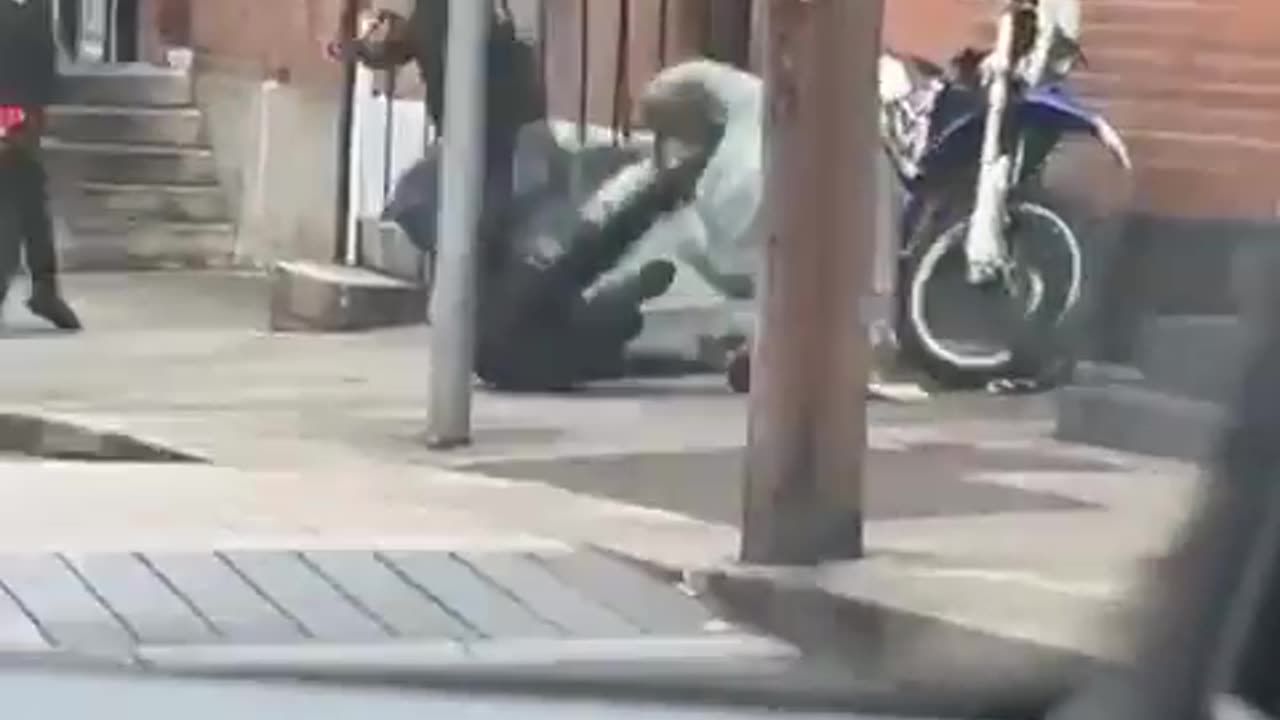 Biker takes down motorbike thieves attempting to steal his bike.