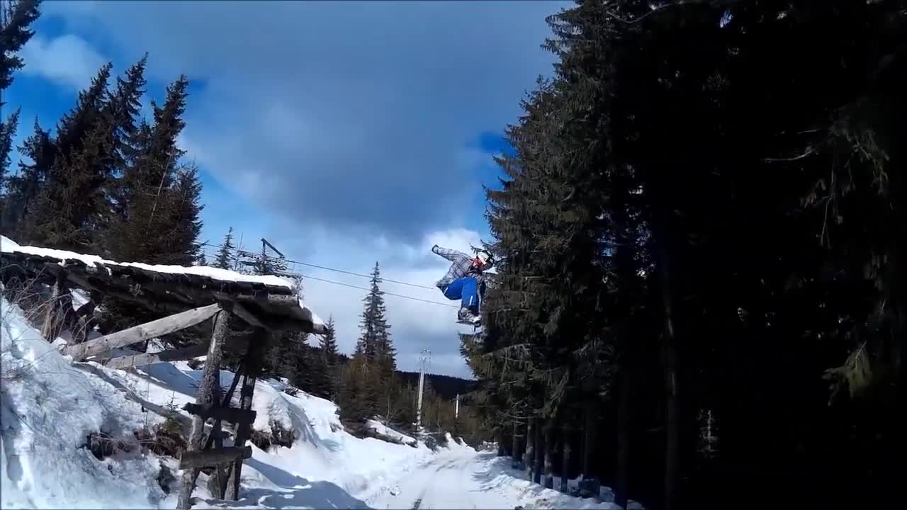 Snowboarding maneuvers on the ice rink
