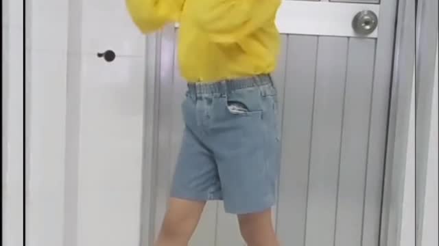 Little girl passionately practicing dancing as instructed on the phone