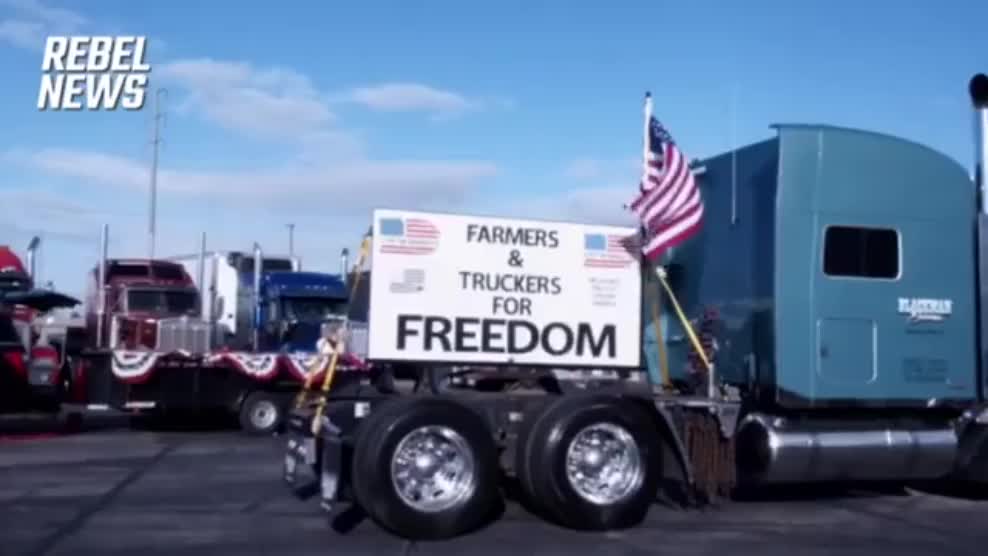 A Truck Flies the Canadian and U.S. Flags as the Freedom Convoy Travels Across the Mojave Desert