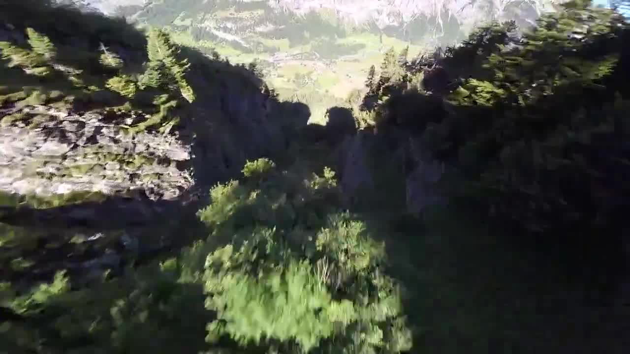 Wingsuit pilot jumps from mountain's edge