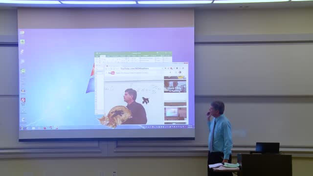 Professor of mathematics corrects the projector screen(first April rally)