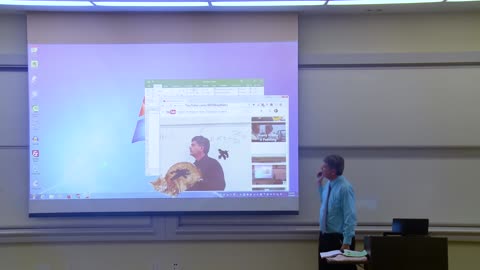 Professor of mathematics corrects the projector screen(first April rally)