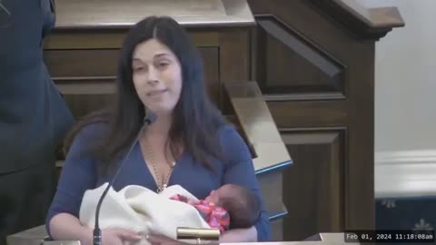 Legislator holds baby while she promotes abortion