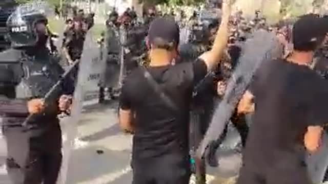 Riot police and security forces heavily deployed at the entrance gates of the Baghdad Green Zone