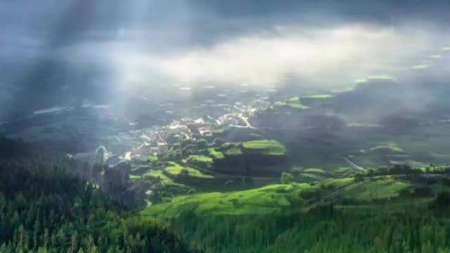 Buildings under the mountain stream