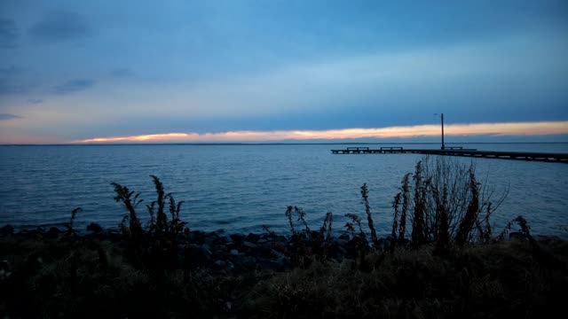 Cloudy Sky Explodes With Sunlight Over Bay