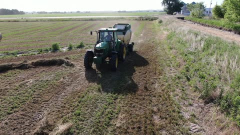 Fly close to rear of baler