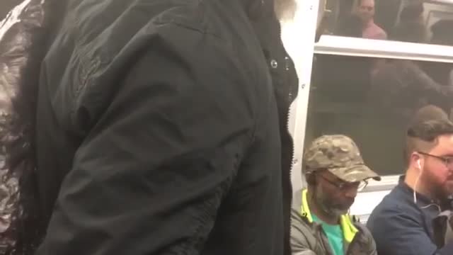 Guy singing god bless america on subway