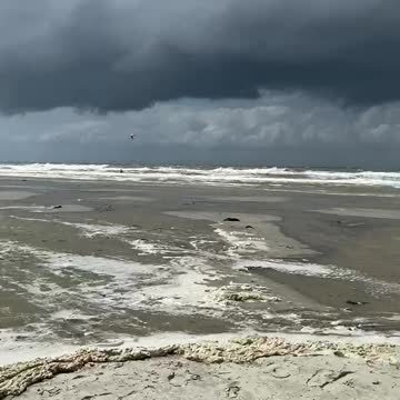 Insane jump of kite surfer.