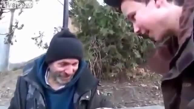 A kid from Ukraine performs a magic trick with coffee for a homeless guy