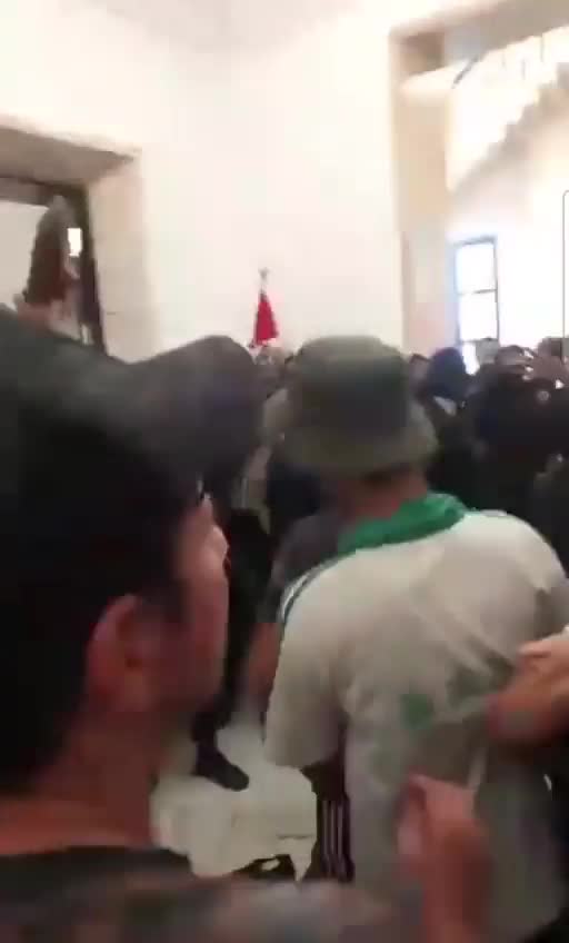 Protesters storm the Presidential Palace in Baghdad, Iraq.