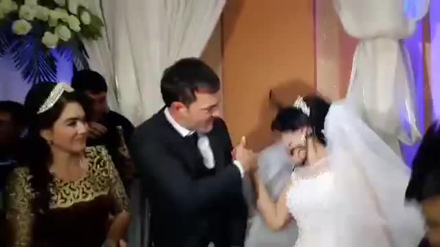 Husband slap his wife for joking with him on their wedding day.