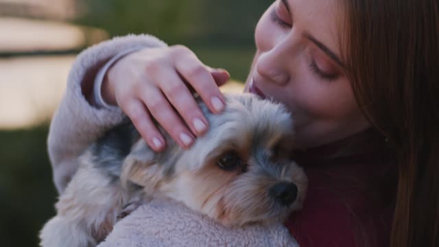 Beautiful woman With A Cute Dog On Her Shoulders video