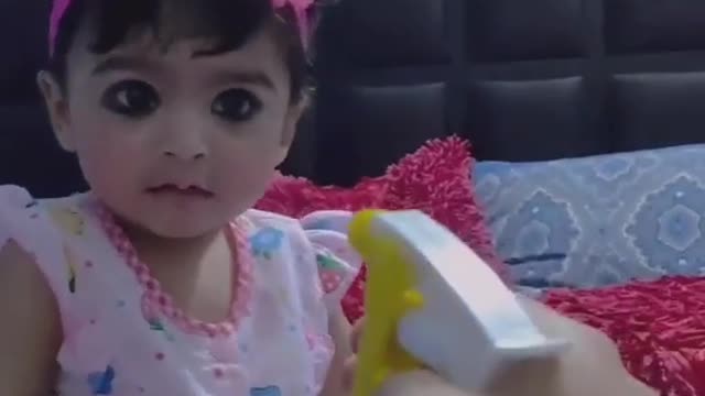 Cute baby reaction on water spray