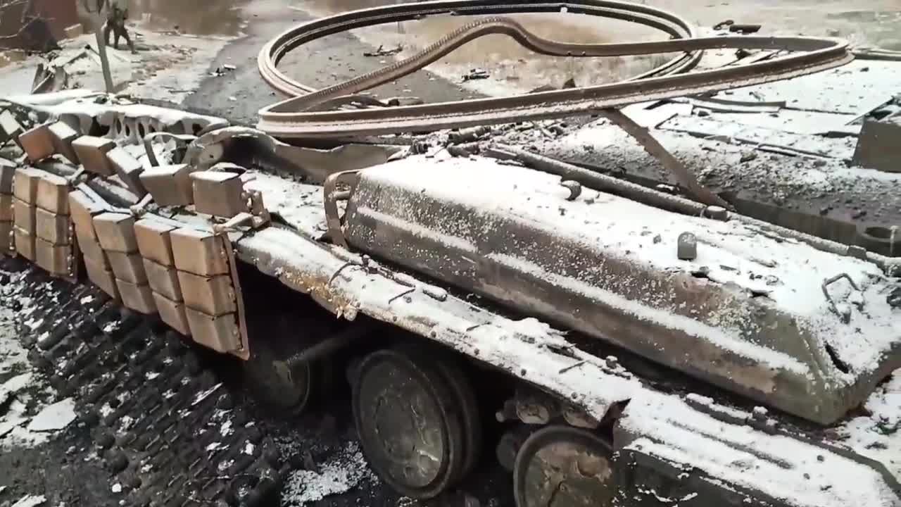 T-64 Tank destroyed and the flag of the DPR raised over the Novotroitsk