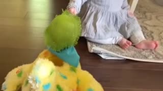 Baby utterly shocked at toy hen laying eggs HD