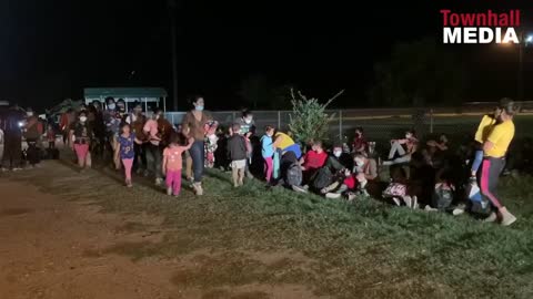 Migrants Seen Sneezing and Coughing After Crossing Border