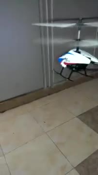 Children flying a remote control helicopter