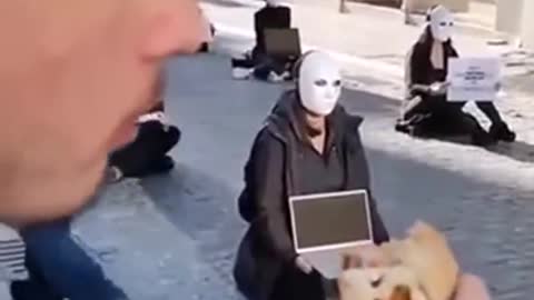Eating a juicy burger at the vegan silent protest