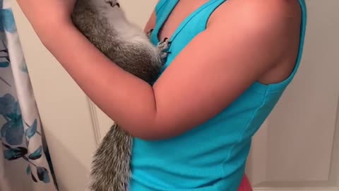 Squirrel Loves Being Held by His Best Friend