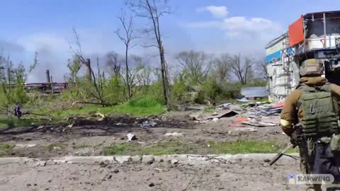 A Russian soldier walks around Azovstal