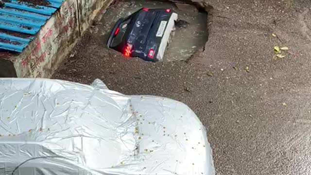 Car Swallowed By Sinkhole At Mumbai Parking Lot After Rain.