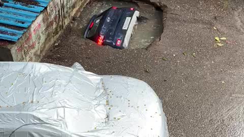 Car Swallowed By Sinkhole At Mumbai Parking Lot After Rain.