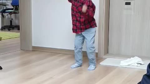 Video of a child dancing to a Korean song.