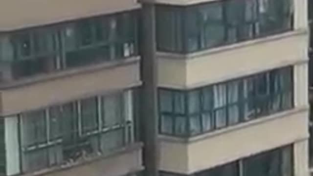 Shocking! Children playing on the top of a building