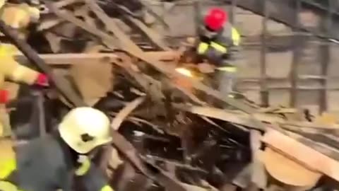 Russian Firefighters Cutting Through Collapsed Roof