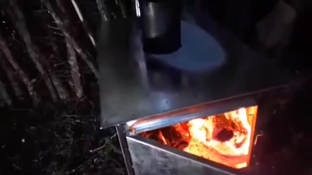 Cooking On The New Stove In The Bushcraft Shelter