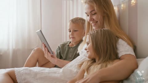 Mother and her kids watching on the tablet