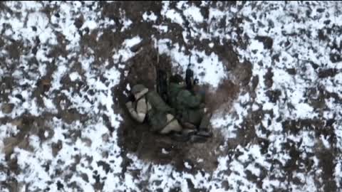 Russians waving to Ukr drone