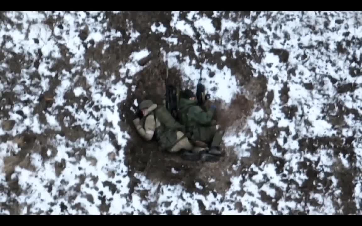 Russians waving to Ukr drone