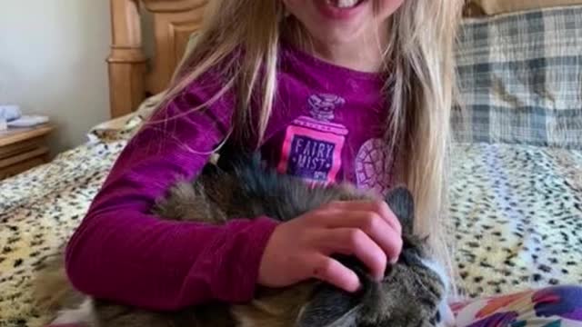 Girl and cat share bond over arm amputation