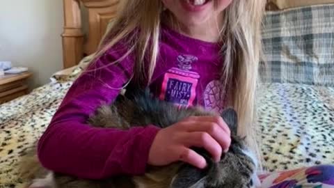 Girl and cat share bond over arm amputation