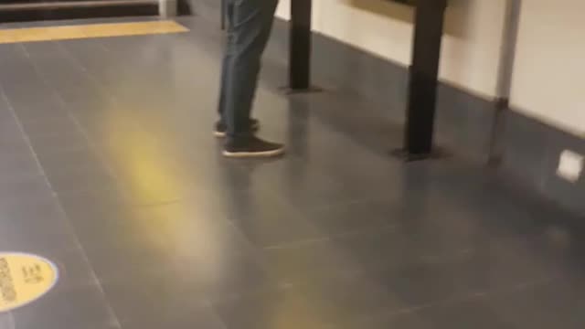 An old man dancing to violin music and captain america in a subway from buenos aires