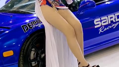 Blue sports car, model with long legs