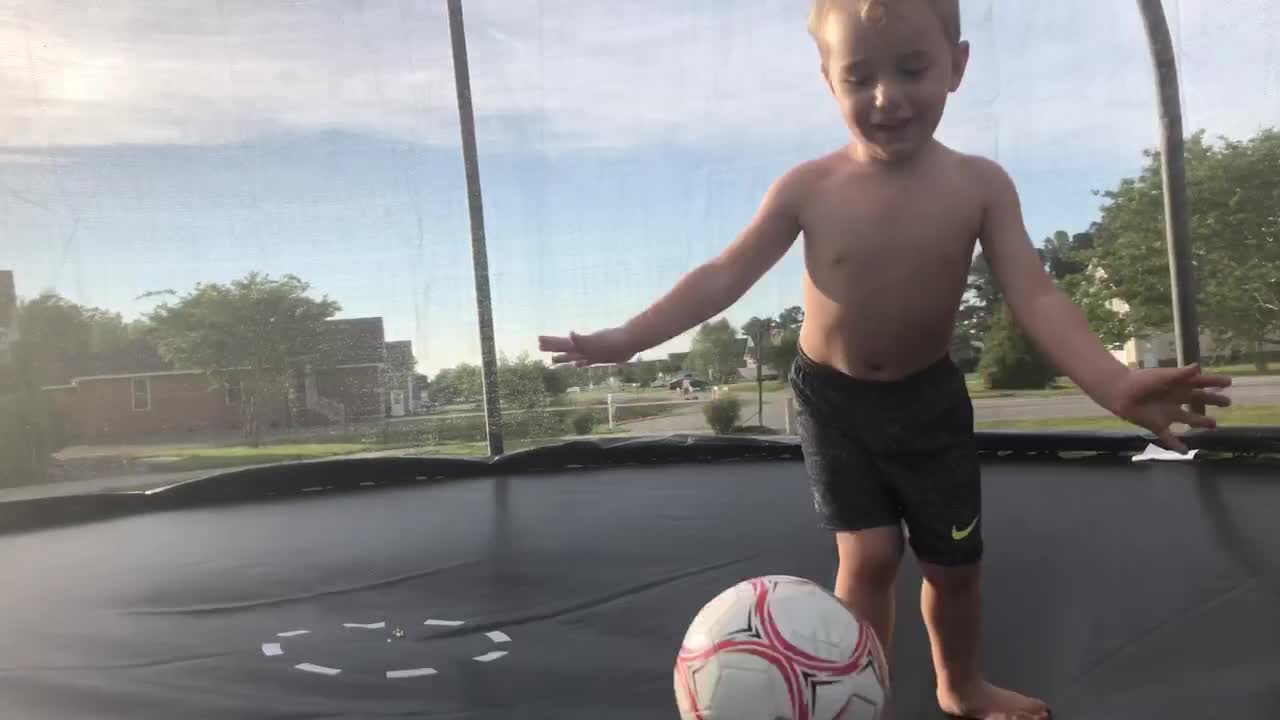Energetic Toddler Throws Ball In Dads Face While Trying To record Memories