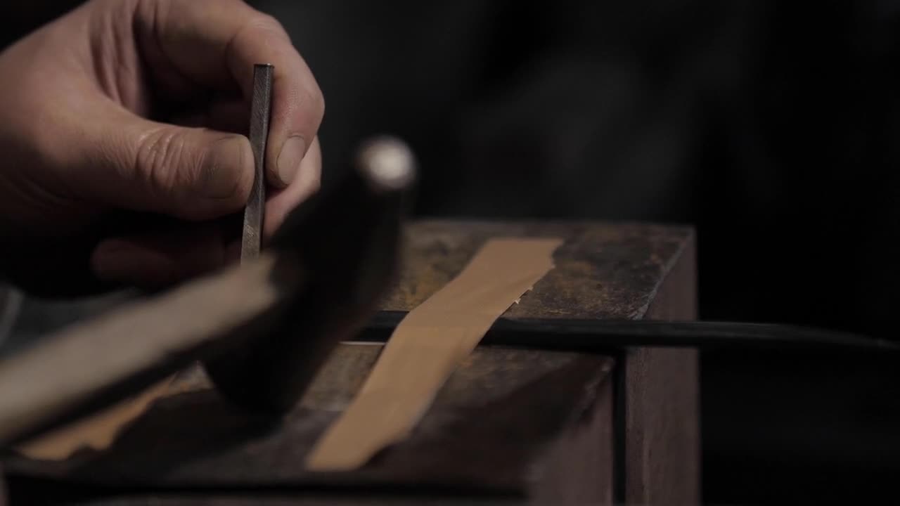 Close up of a Person Engraving a Metal Blade | HD
