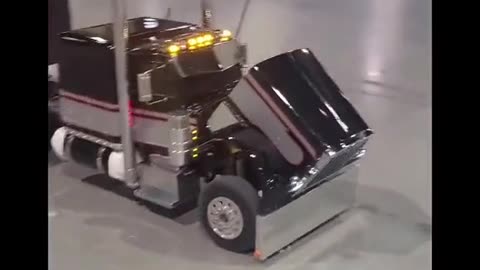 I got the big boy driving the little boy getting in the car? A man's toy truck driver