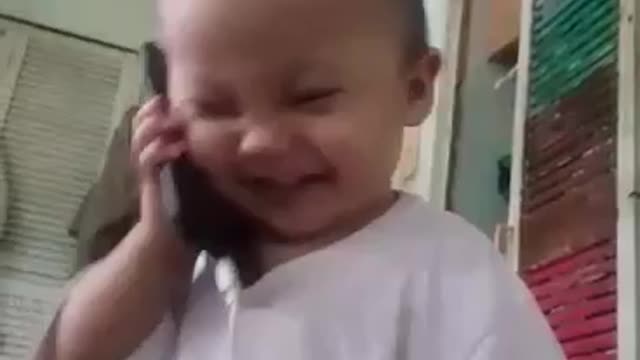 Cute Baby Pretends To Talk On The Phone! Seems Serious! Lol.