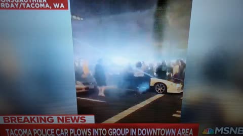 cop runs over a crowed of people on video
