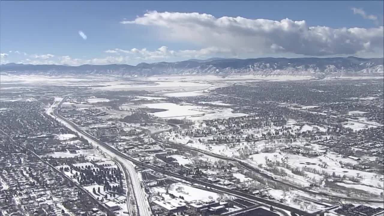 RAW_ Aerial view of snow-capped mountains along Colorado’s Front Range