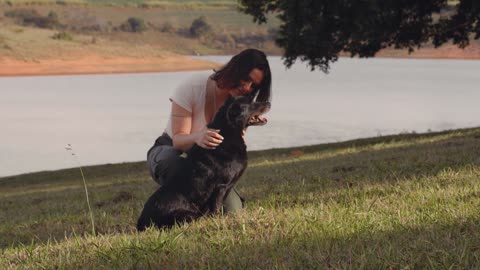 Beautiful lady taking dog for a walk