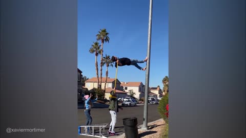 Guy Walks up a Street Light