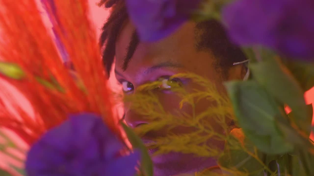 Look of a man through flowers